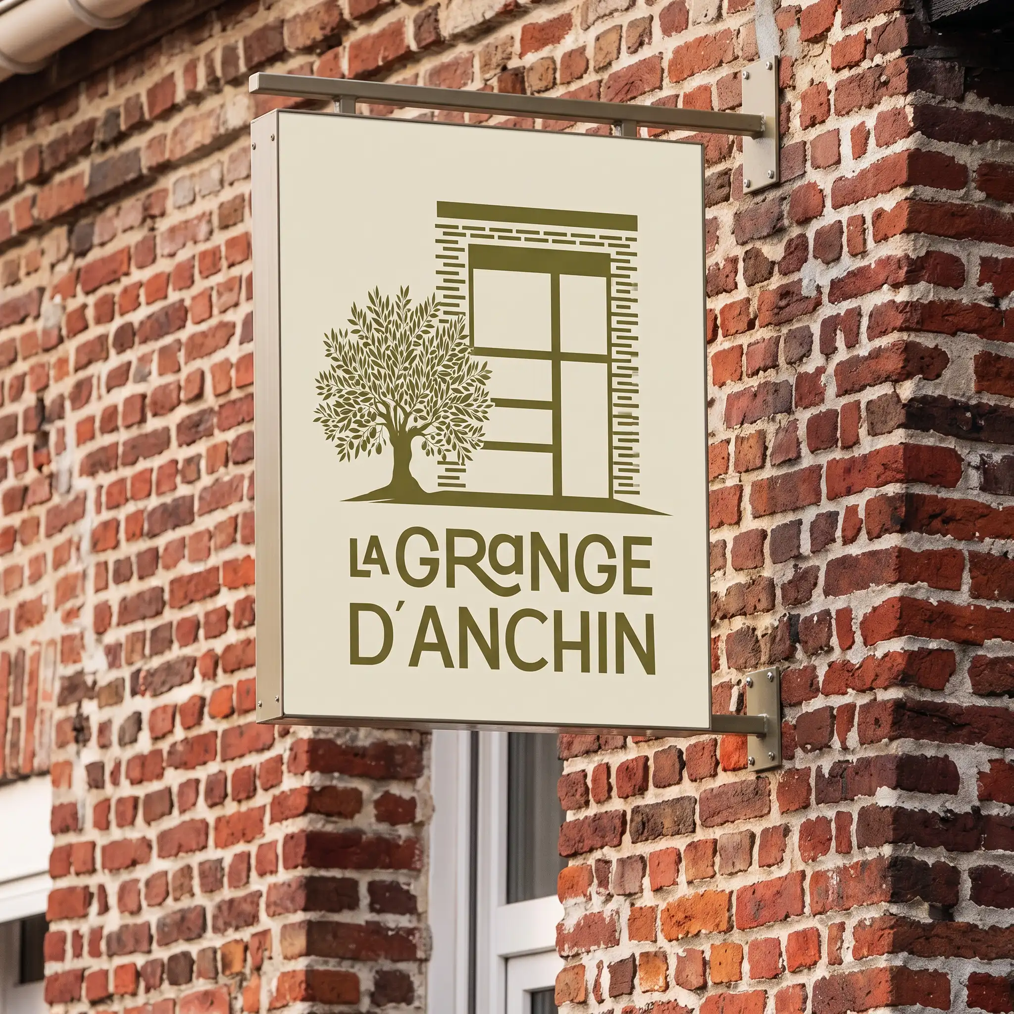 Enseigne La Grange d'Anchin sur le mur en briques